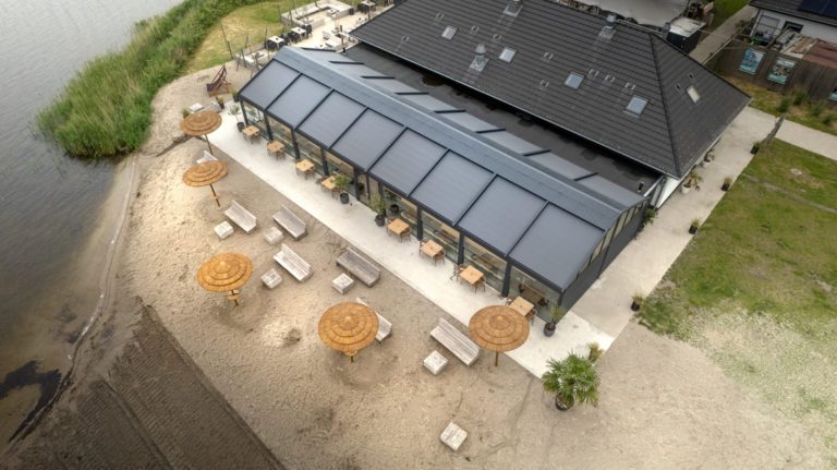 Outdoor restaurant terrace using Soltis 96 Proof fabric for solar protection and visual comfort