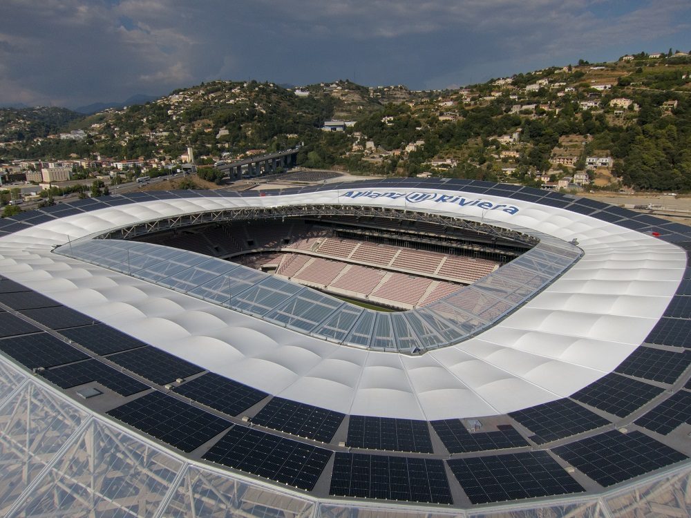 Aerial view of Allianz Riviera Stadium featuring a tensile membrane roof with integrated solar panels