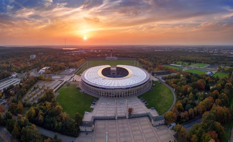 Aerial view of Berlin Olympic Stadium featuring a renovated tensile membrane roof