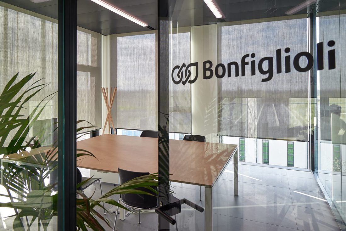 Bonfiglioli glass meeting room with interior textile roller blinds