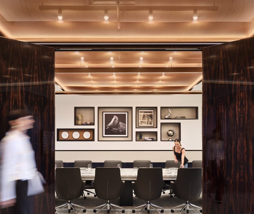 Modern workstation at Corsair NYC with warm-tone ceilings and contemporary furniture