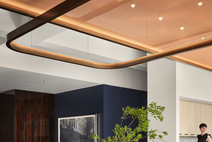 Detailed image showing the custom aluminium rectangular frames (with rounded corners) used to install the Serge Ferrari stretch ceilings, highlighting the technical craftsmanship behind the elegant interior design at Corsair’s New York headquarters.
