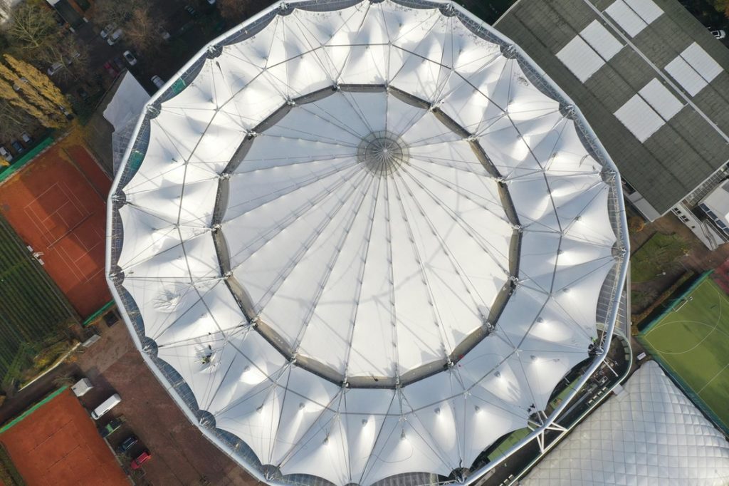 Aerial top view of Rothenbaum tennis stadium with circular tensile membrane roof