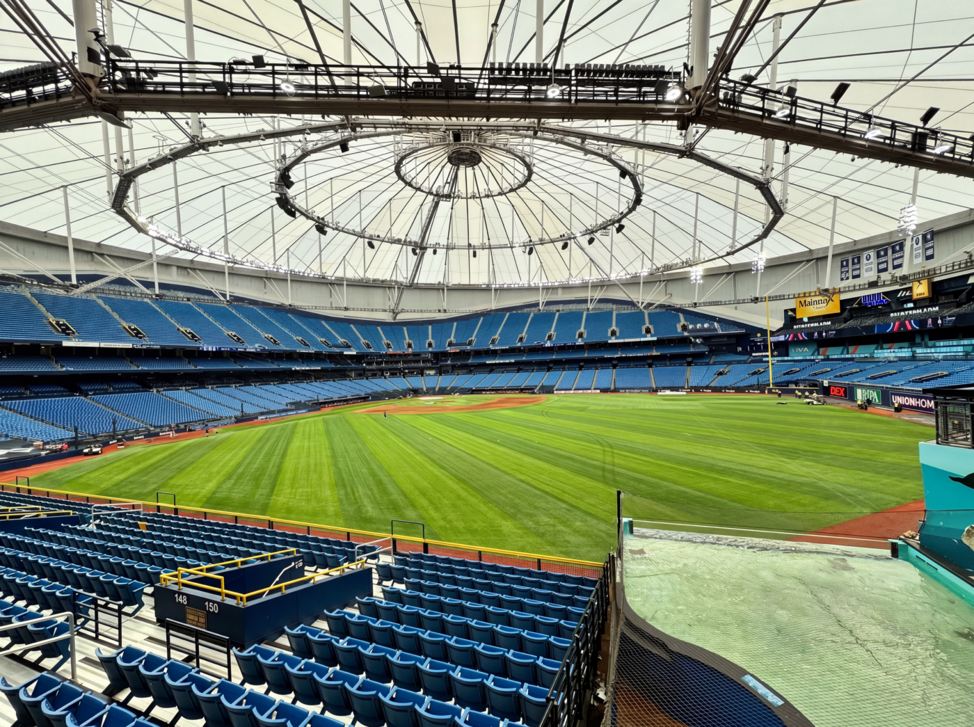 Wide-angle view of Tropicana Field's playing surface beneath the stadium's tensile membrane roof.