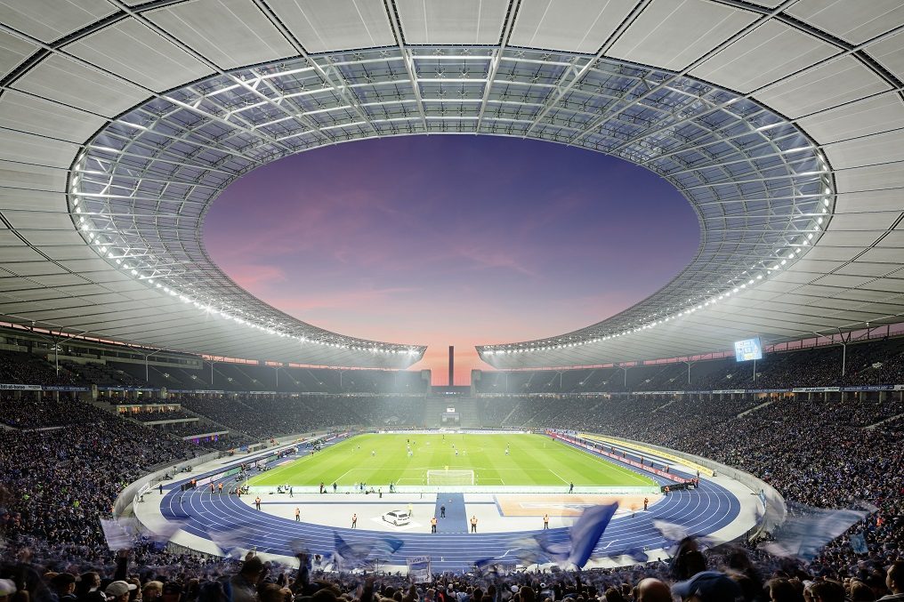 Interior view of Berlin Olympic Stadium under a modern tensile membrane roof