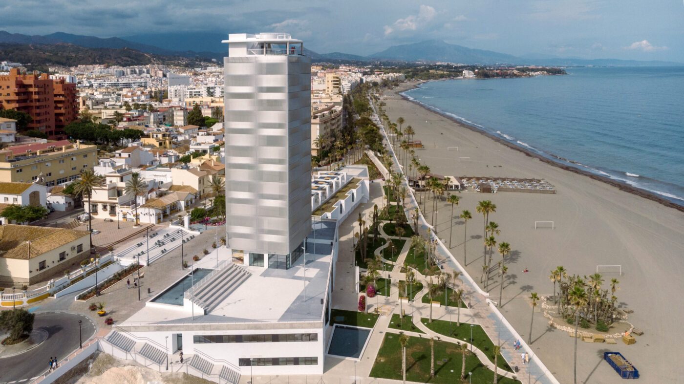 Aerial view of Mirador del Carmen tower overlooking Estepona beachfront