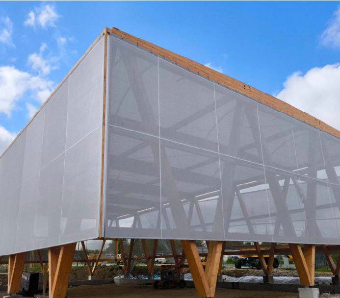 Exterior view of Handball Center Créteil featuring a translucent tensile membrane façade